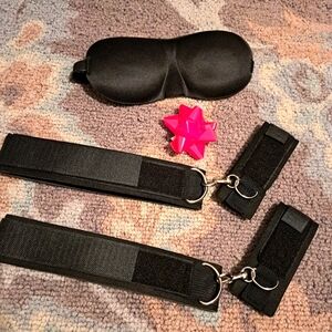 Novelty wrist and thigh cuffs with blindfold for adult playtime